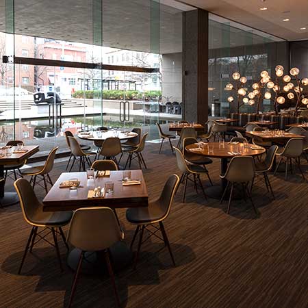 Inside our cafe looking out of a glass wall that overlooks the fountain