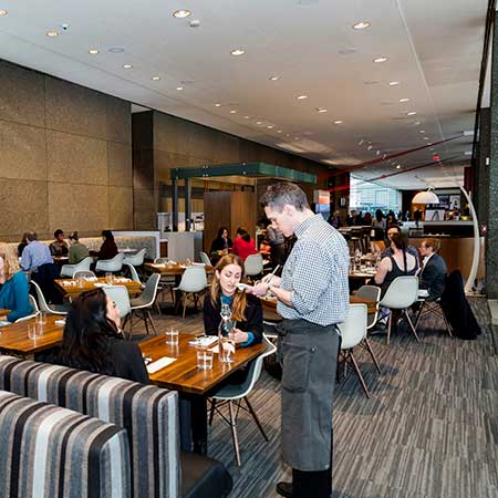 Waiter taking a guest's order